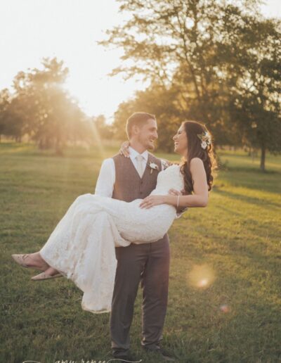 Groom sweeps bride off feet