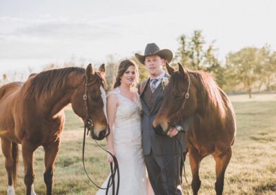This bride and groom brought their horses to the ranch so they could have portraits made with them after the ceremony. Image by www.maudielucasphotography.com.