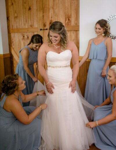 Brittany's bridesmaids fuss over her gown