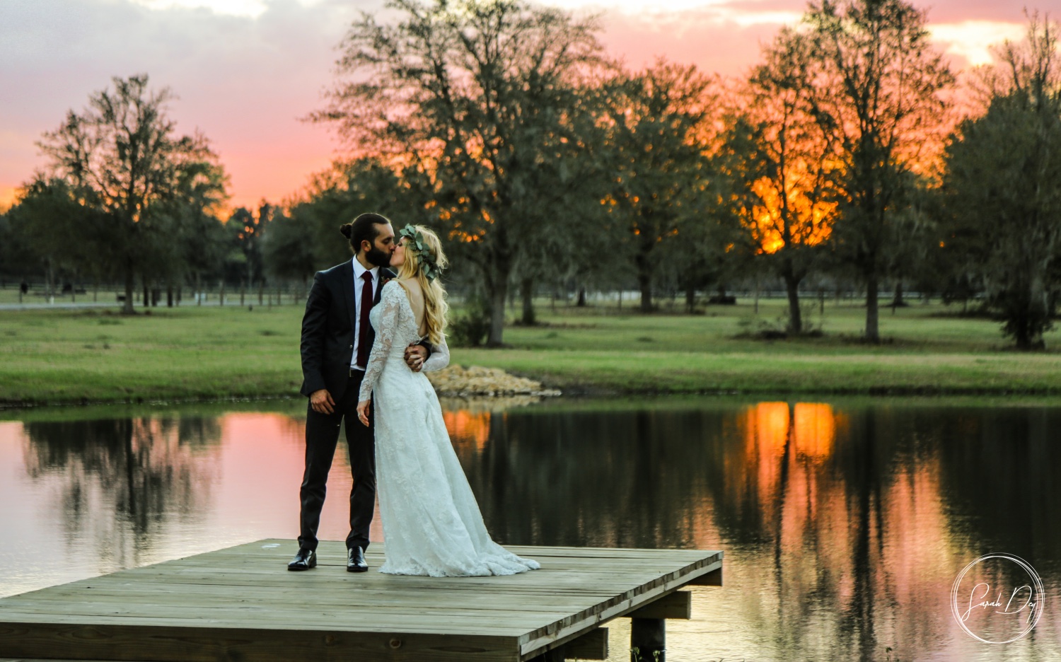 Sunset in February Bride and groom on pond at sunset