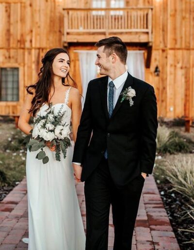 This bride and groom could hardly contain their joy after their lovely December wedding. Image by 28 North Photography, www.28North.co.