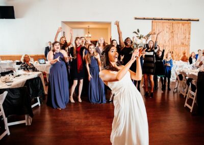 There was plenty of excitement when this bride started her bouquet toss. Image by 28 North Photography, www.28north.co.