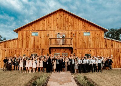 Wedding guests rejoice at barn front