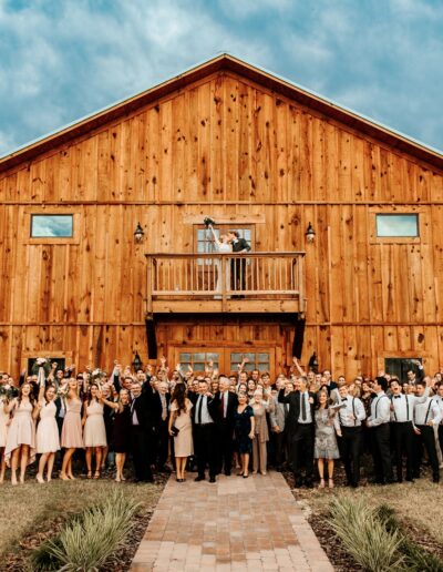Wedding guests rejoice at barn front