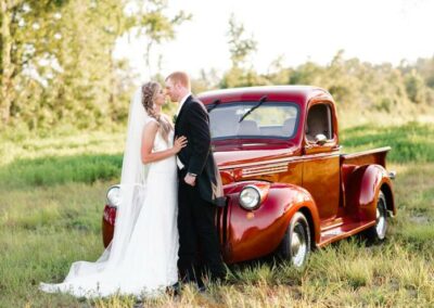 The bride arrived at the wedding ceremony site in this antique truck. After the reception, the couple used it as their getaway vehicle. Photo by AmberDornPhotography.com.