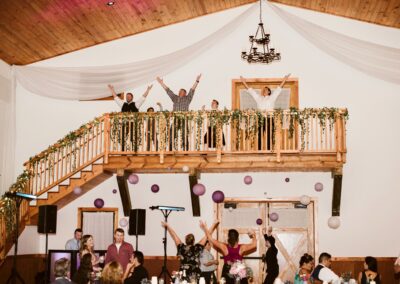 The luxury events barn at C Bar Ranch is the perfect place for fun and beautiful celebrations. Guests enjoy dancing on the balcony above the dance floor.