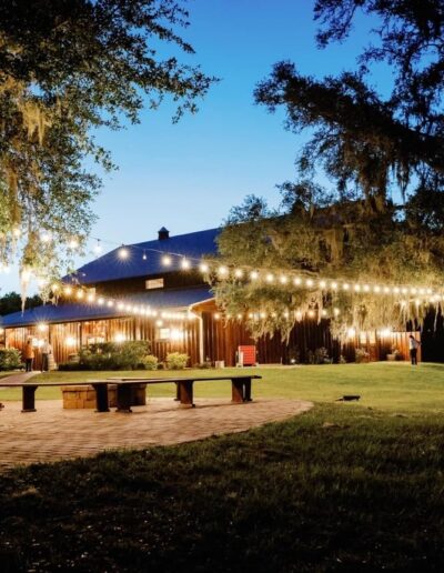 The patio at C Bar ranch has a fire pit, seating and market lights.