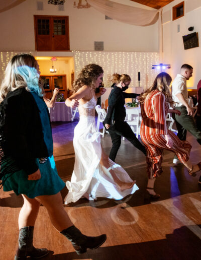 Bride dances with guests at C Bar Ranch.